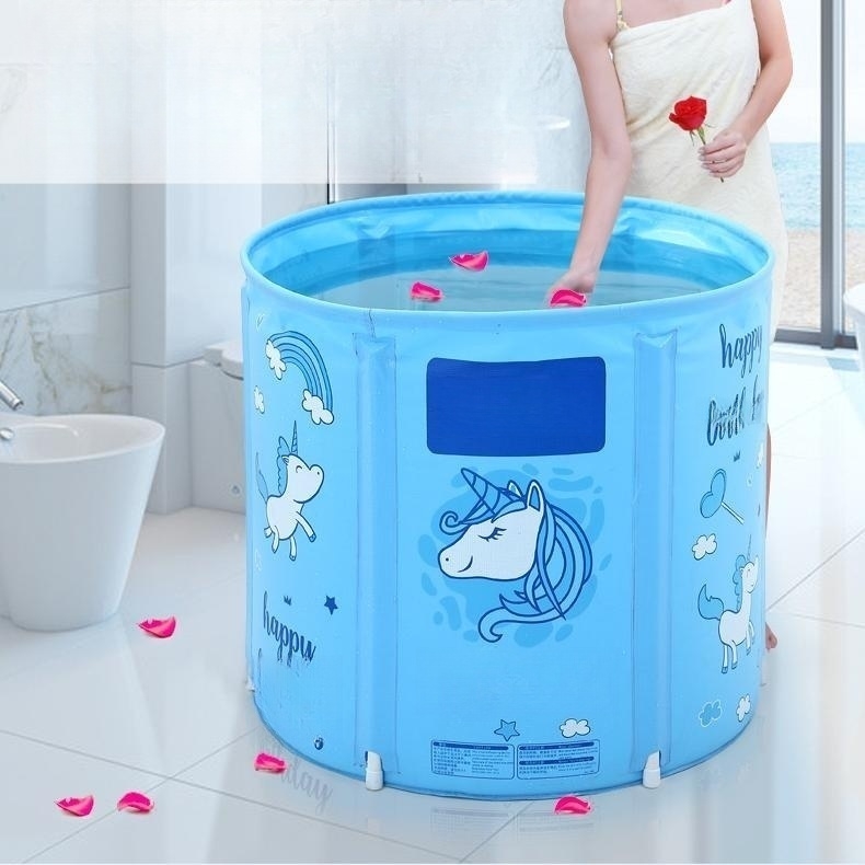 foldable blue bathtub adorned with scattered rose petals