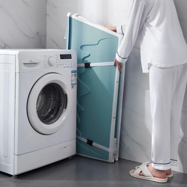 portable bathtub stored upright against a wall