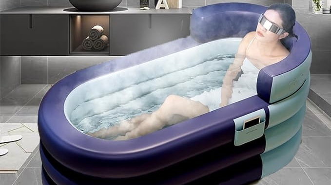 a woman is showering in the  portable bathtub